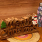 Wooden carved Merry Christmas decoration 38 cm long with Tree and Star