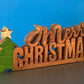 Wooden carved Merry Christmas decoration 38 cm long with Tree and Star